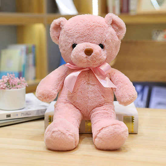 ours en peluche rose assurant