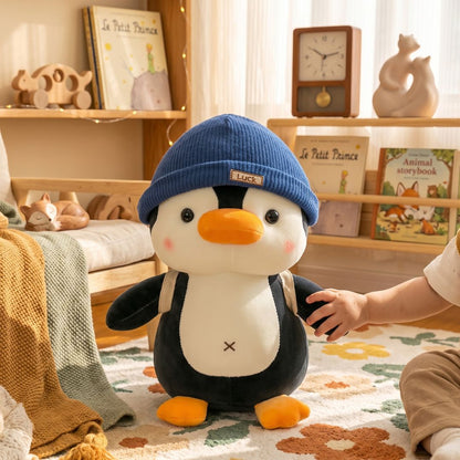 doudou pingouin chapeau bleu presence apaisante