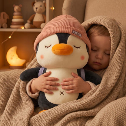 doudou pingouin chapeau rose repere affectif