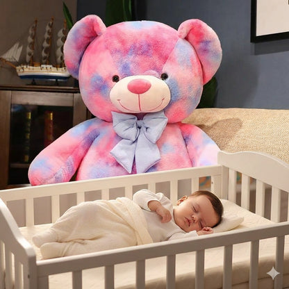 ours en peluche geant rose dormir paisiblement