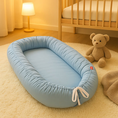 reducteur de lit bebe bleu nid confortable